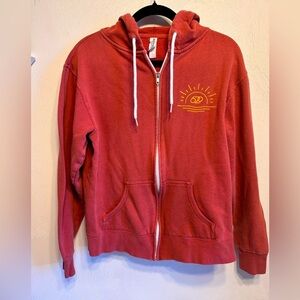 Women’s zip up beach hoodie “Forever Chasing Sunshine” logo on the back.  Size M